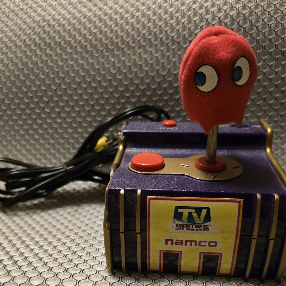 This listing is for a Namco Jakks Pacific Pac Man 5-1 TV Game Plug and Play 2003